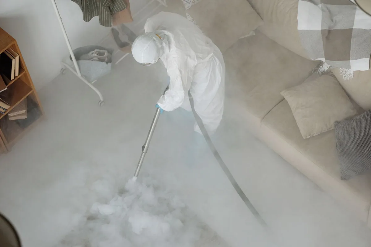 Biohazard cleanup technician in protective equipment, Dayton, OH